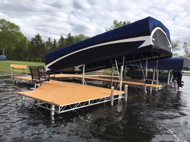 A boat dock with a canopy on top of it
