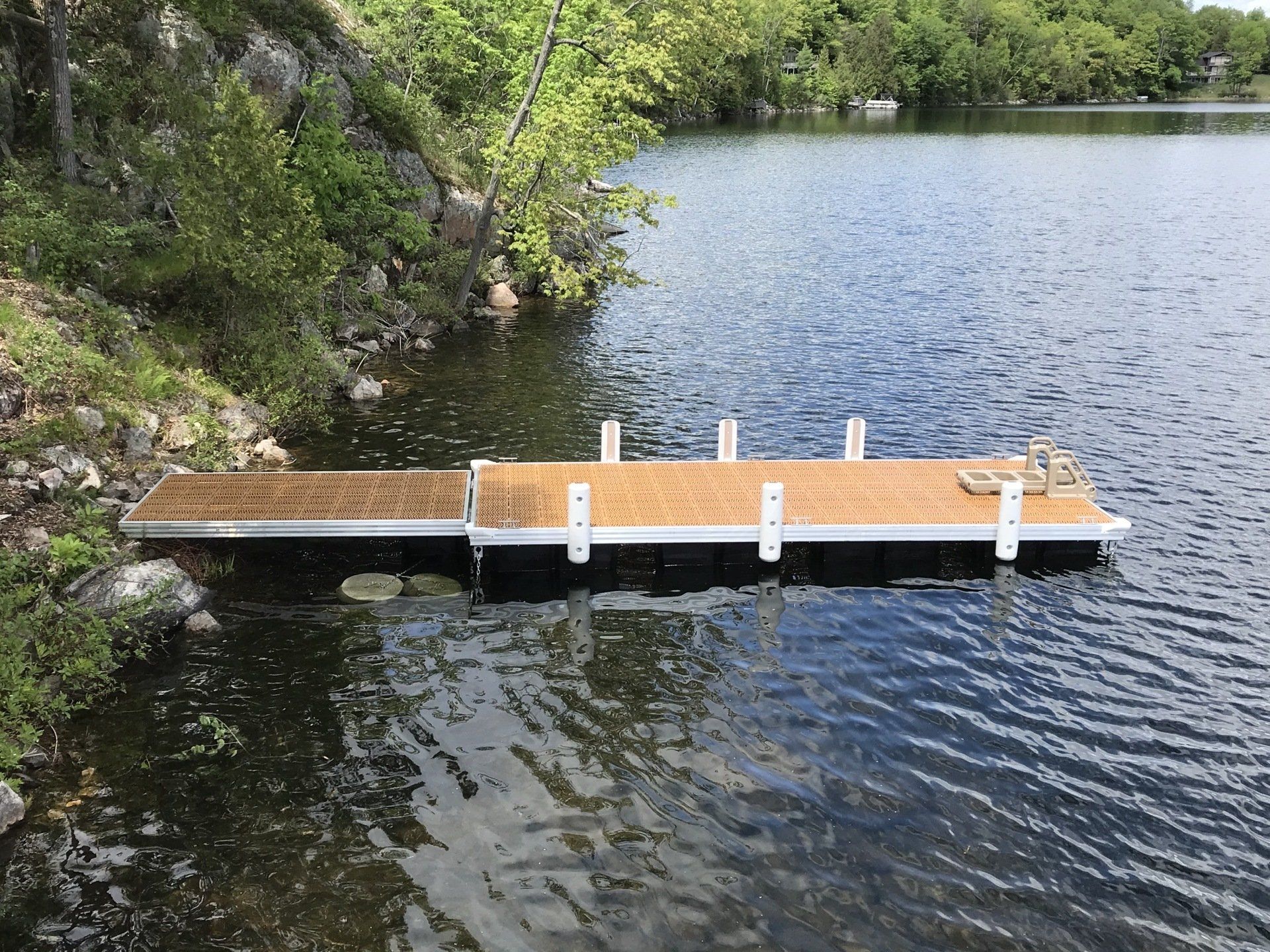 A dock is sitting in the middle of a lake.