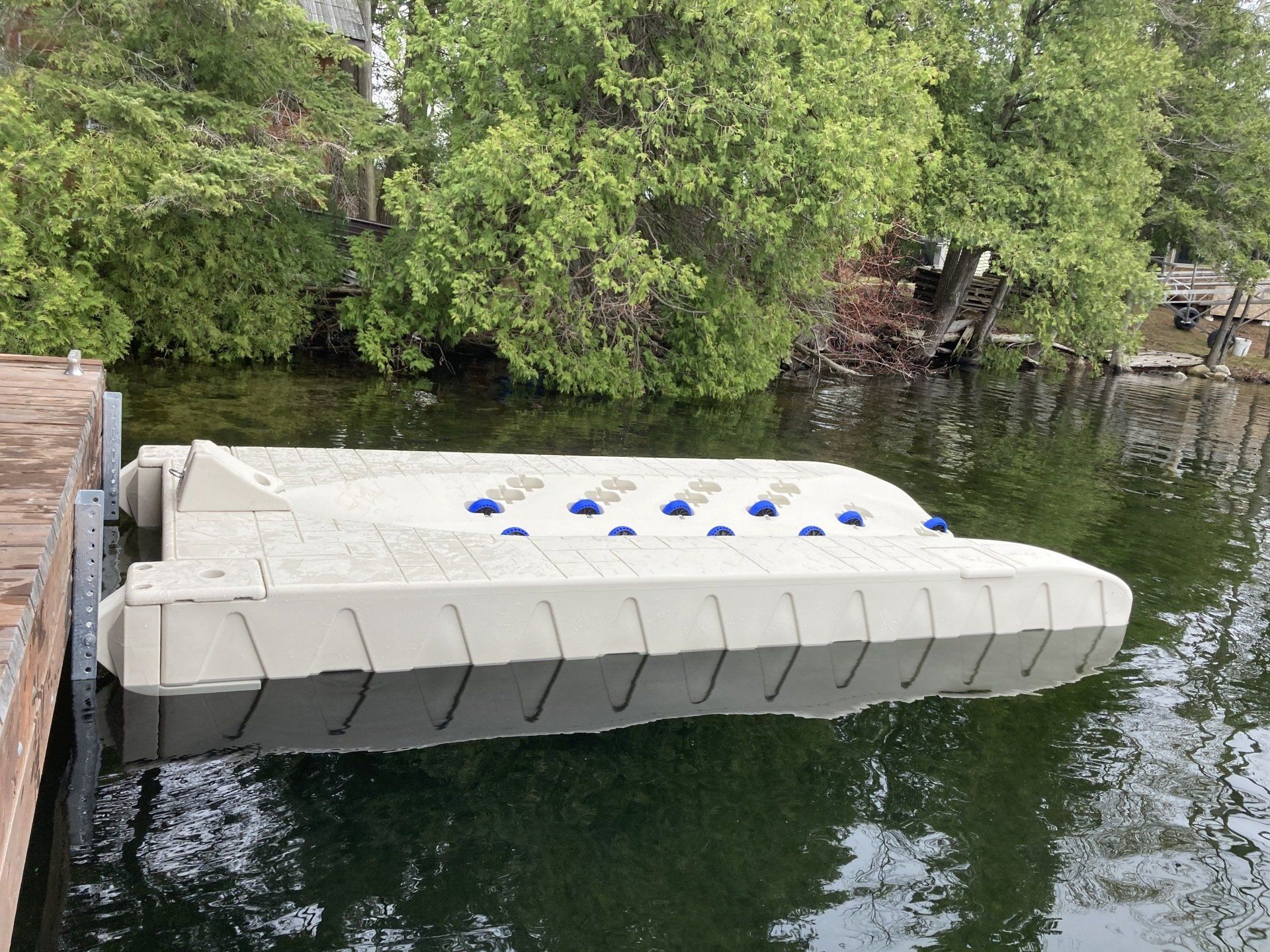 A boat is docked at a dock in the water.