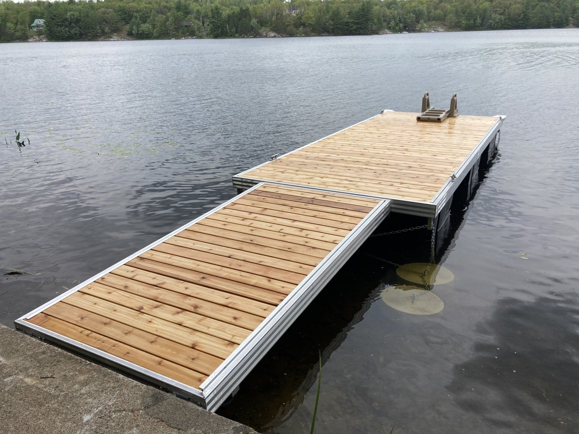 A wooden dock is in the middle of a lake