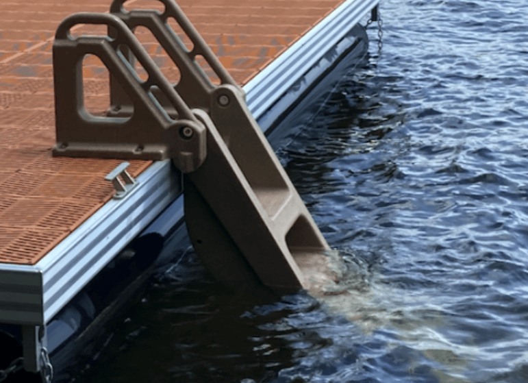 A dock with a ladder going into the water