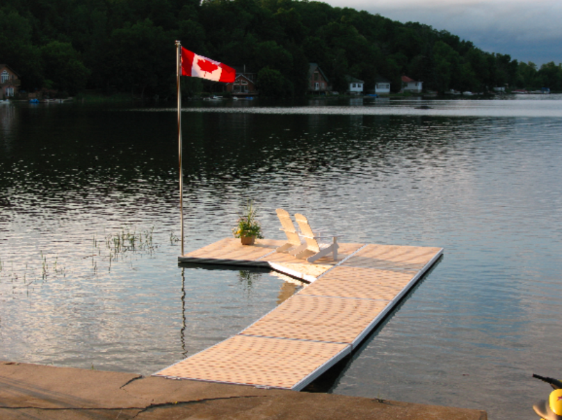 A dock with a canadian flag on top of it