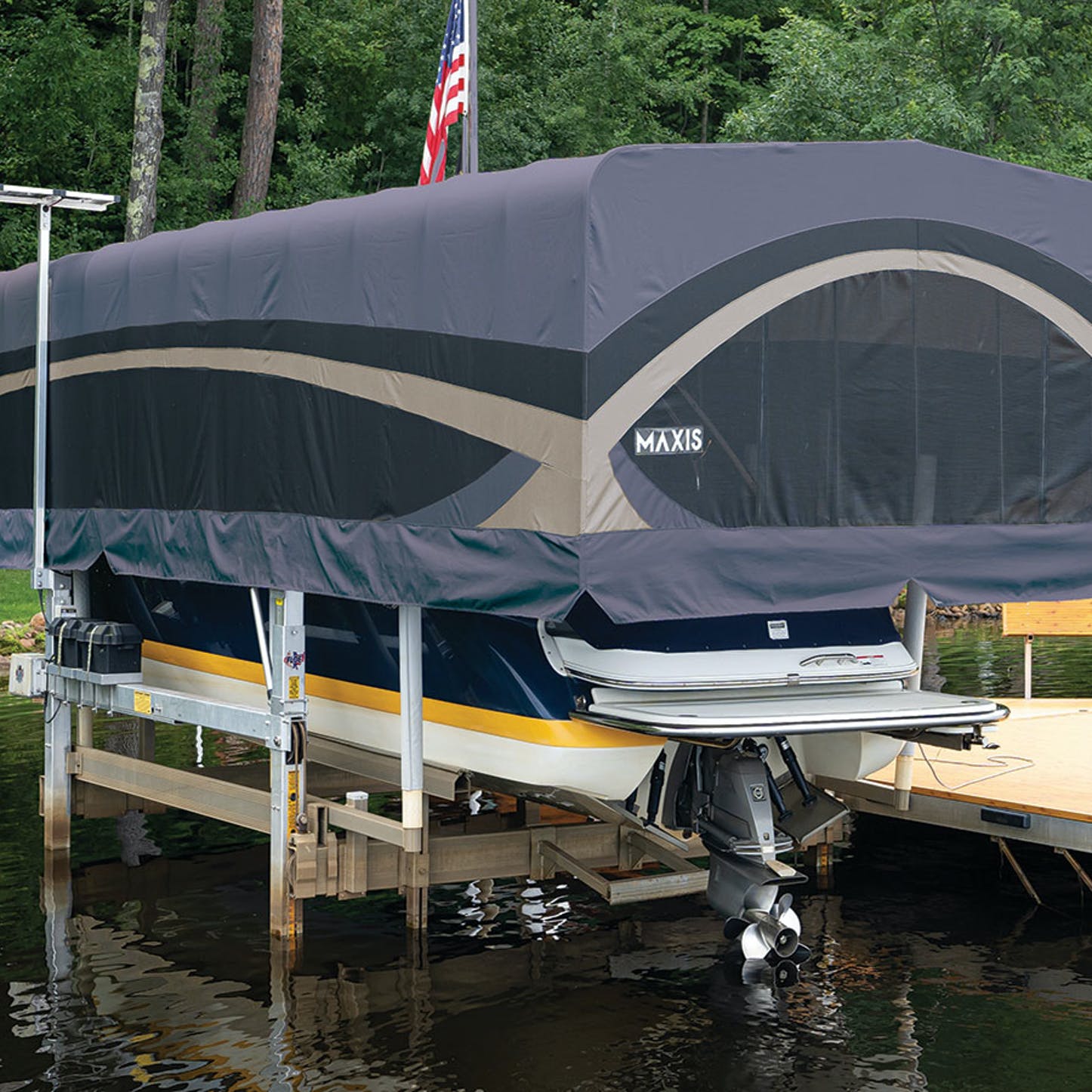 A boat is sitting on a dock with a canopy over it