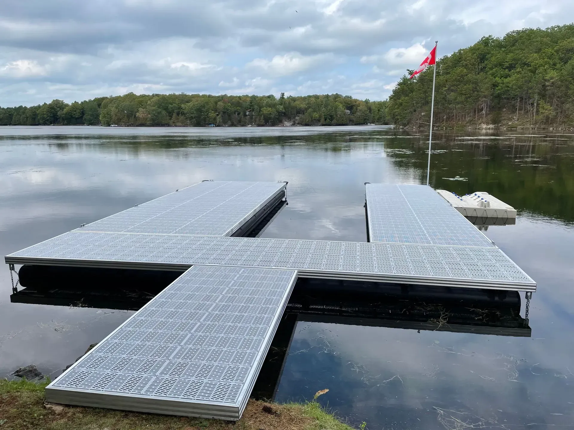 A metal dock sits in the middle of a lake