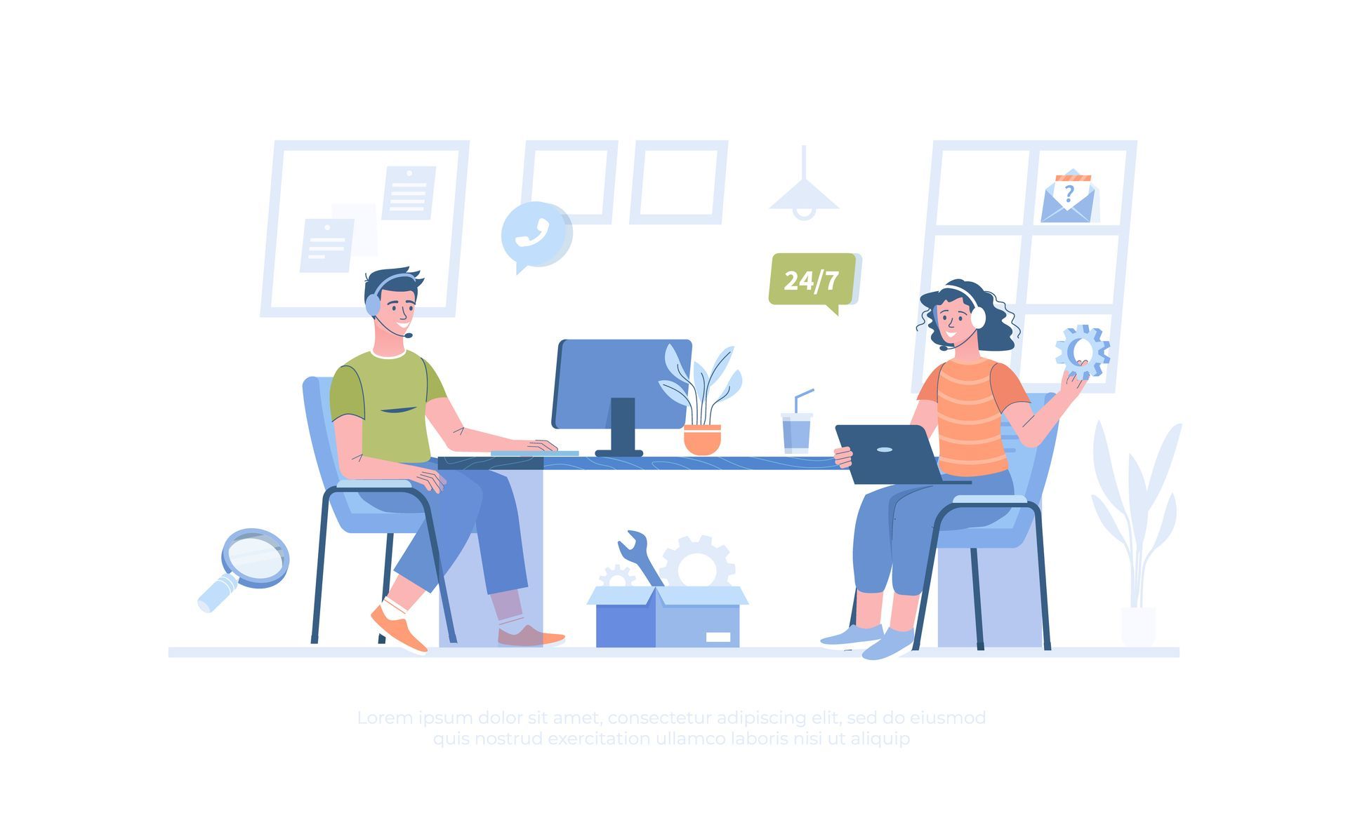 A man and a woman are sitting at a table with computers.