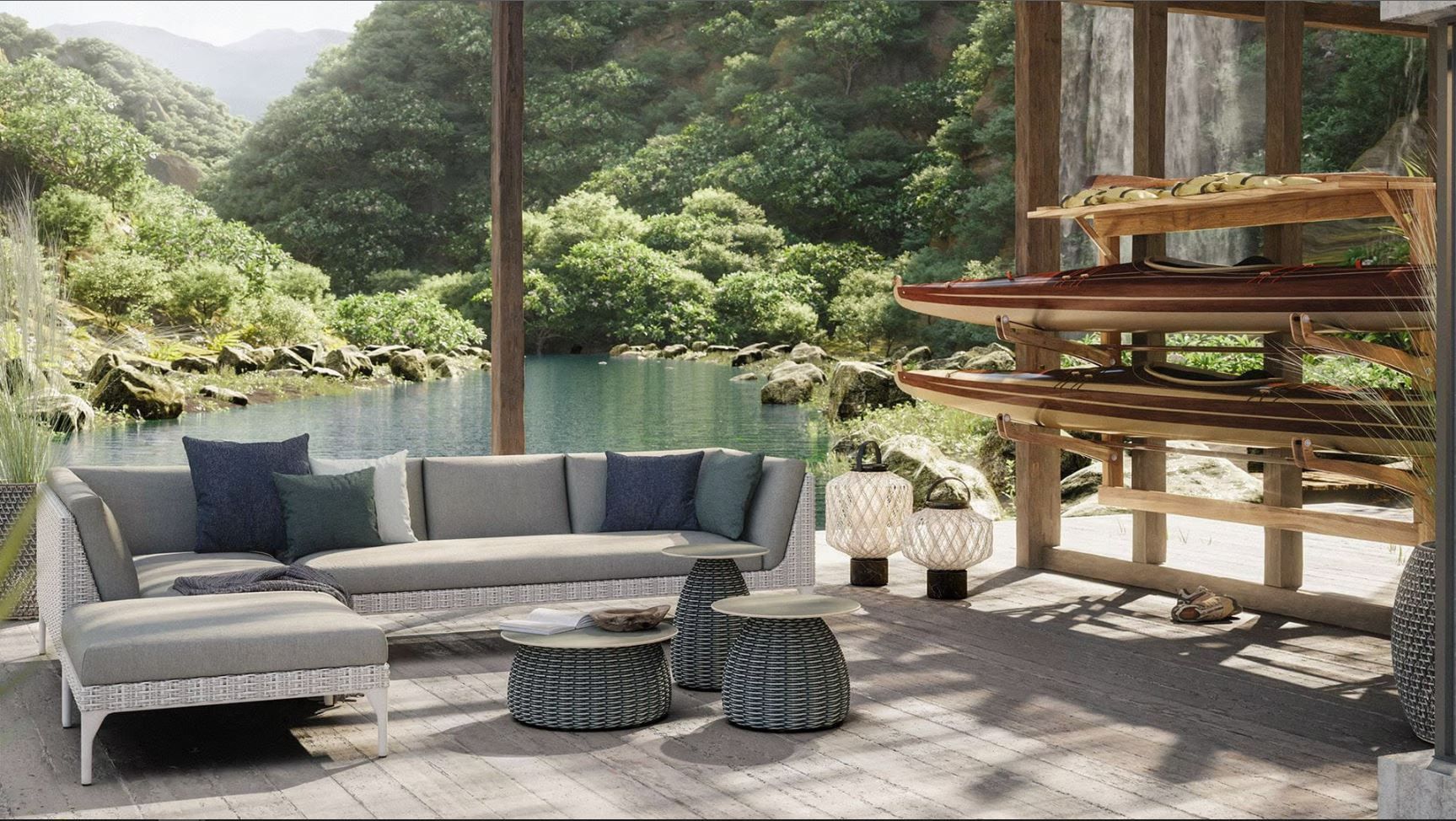 Een terras met een bank, een voetenbankje, tafels en een waterval op de achtergrond.