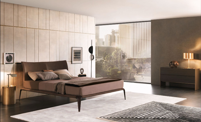 Een slaapkamer met een groot bed en een kleed
