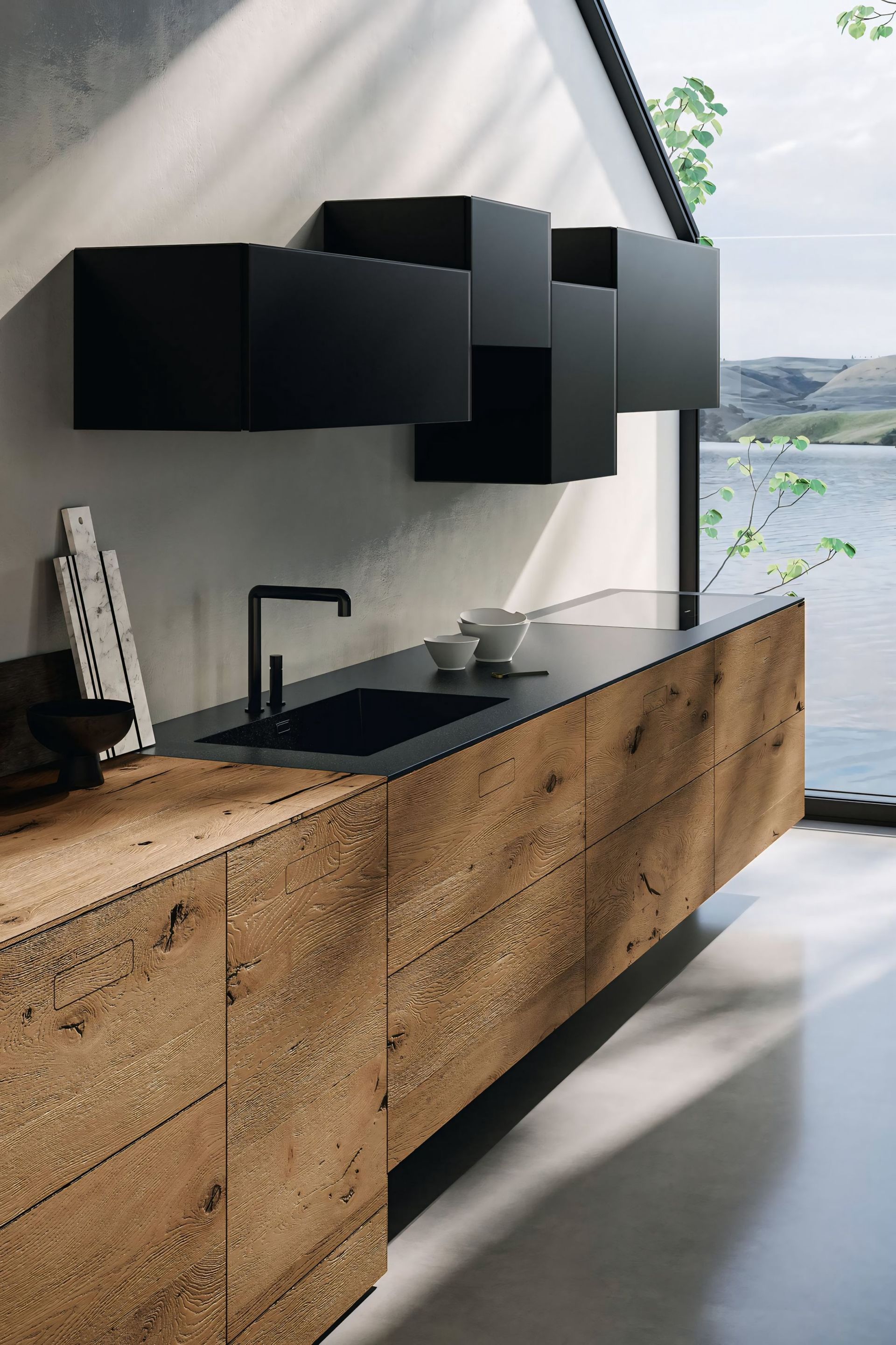 Een keuken met houten kasten en een zwart aanrechtblad