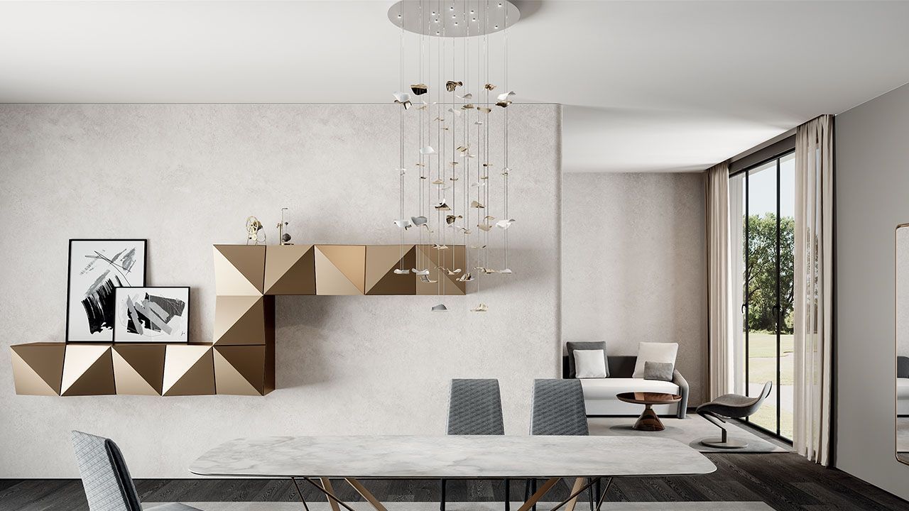 Een eetkamer met een tafel, stoelen en een kroonluchter aan het plafond.