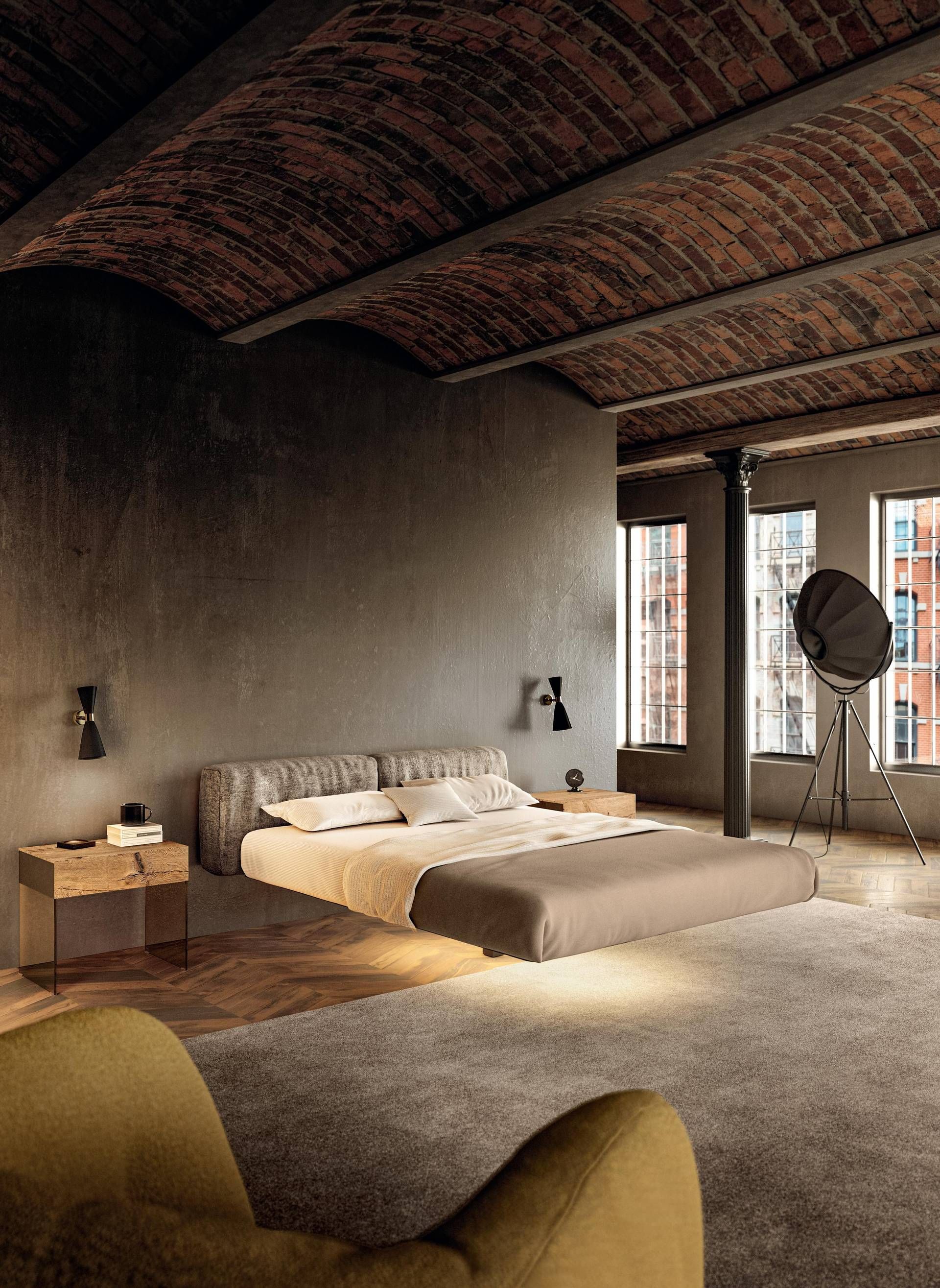 Een slaapkamer met een bakstenen plafond en een bed