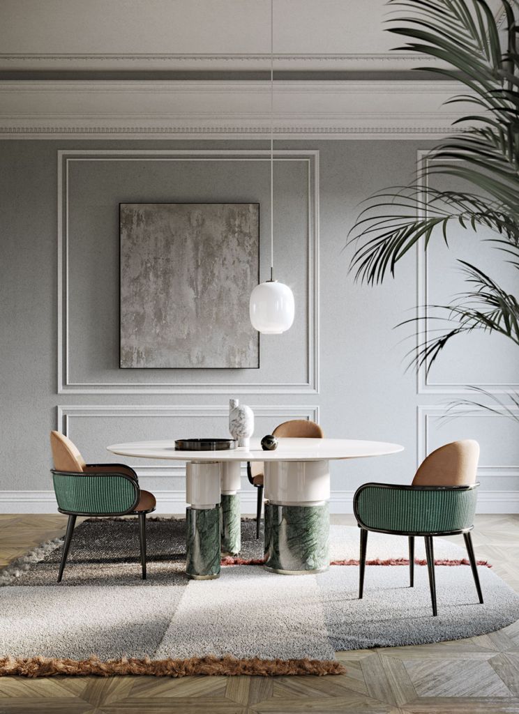 Een eetkamer met een tafel, stoelen en een schilderij aan de muur.