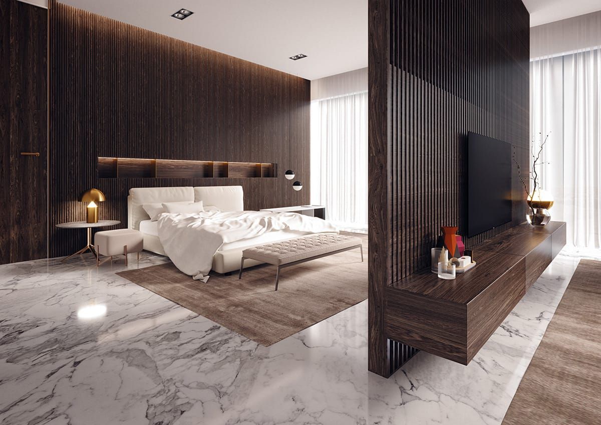 Een slaapkamer met een bed, televisie en marmeren vloeren.