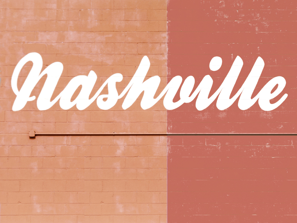 A brick wall with the word nashville written on it A brick wall with the word nashville written on it