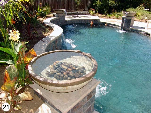 A swimming pool with a bowl of rocks in it