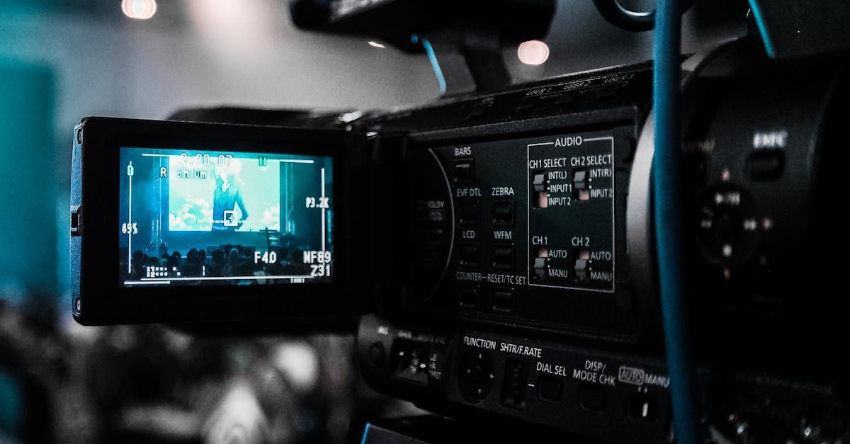 A close up of a video camera recording a video.