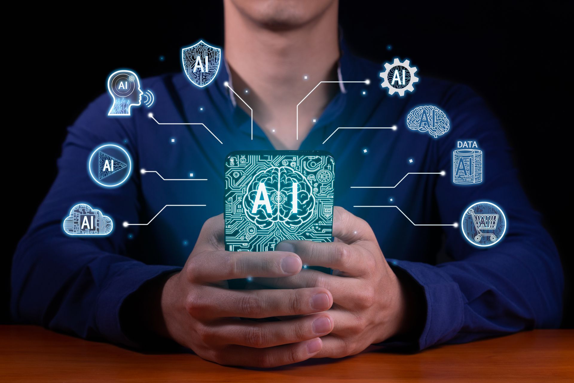 A man is holding a cube with the word ai coming out of it.