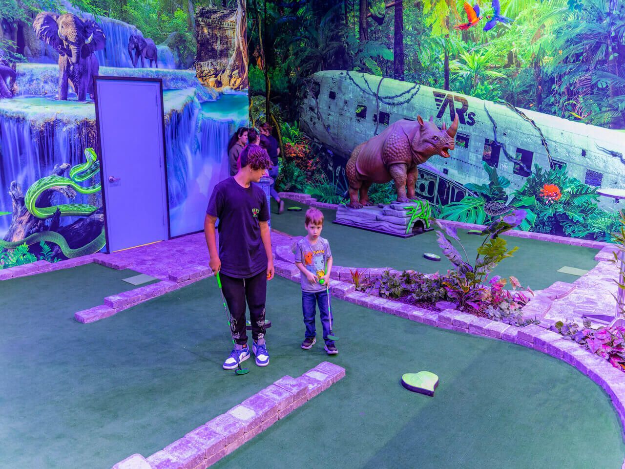 Kids Playing Traditional Indoor Mini Golf