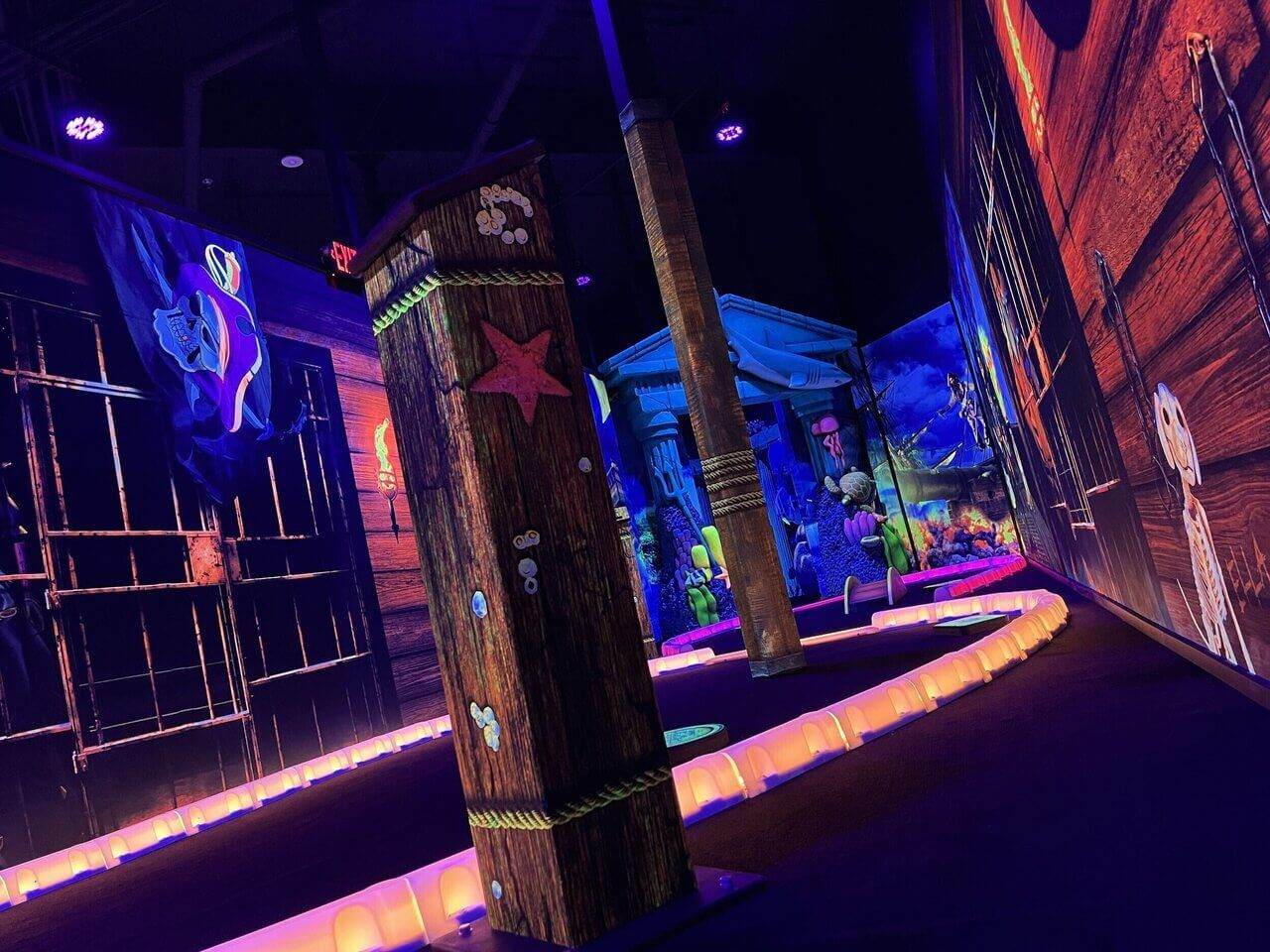 Black light mini golf course built with led glow curbs
