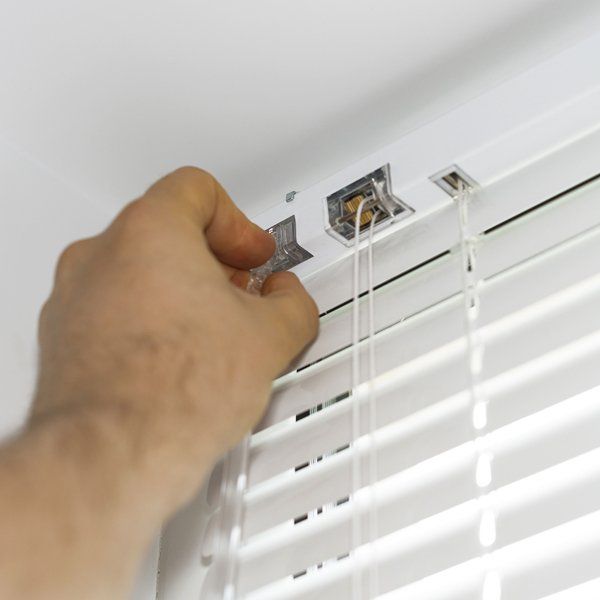 Man Installing Blinds on Windows — Carrum Downs, VIC — Andyworks