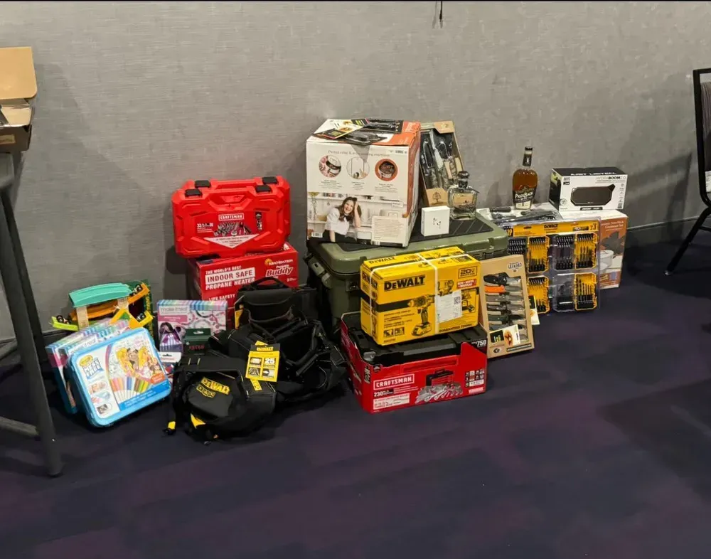 A bunch of boxes are stacked on top of each other on the floor.