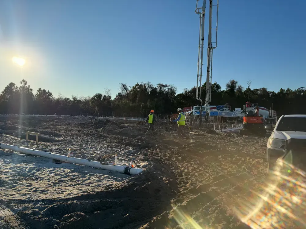 A group of construction workers are working on a construction site.