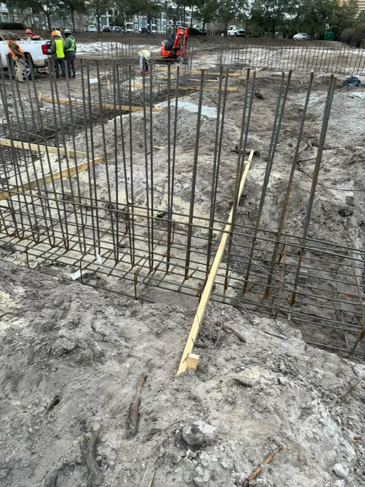 A group of construction workers are working on a construction site.