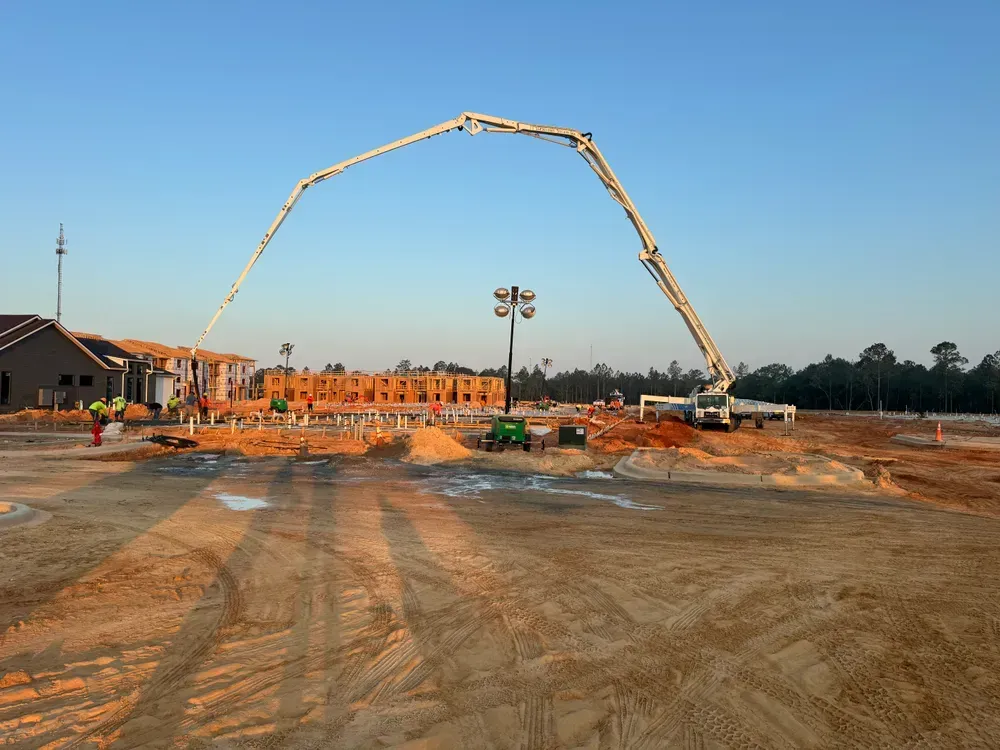 A large concrete pump is being used on a construction site