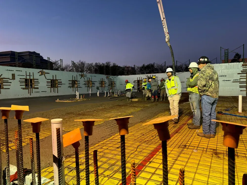 A group of construction workers are working on a construction site