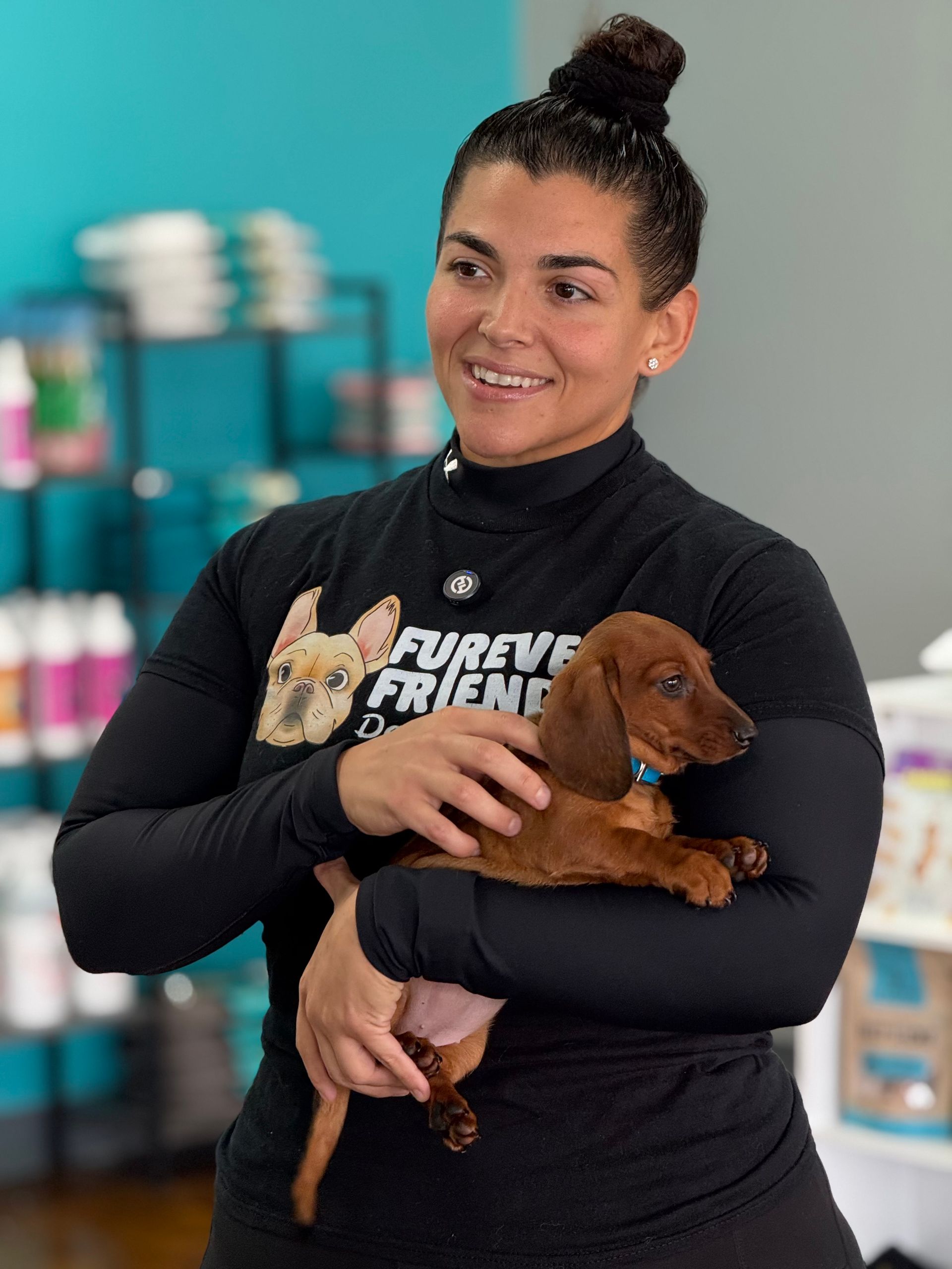 A woman holding a dog