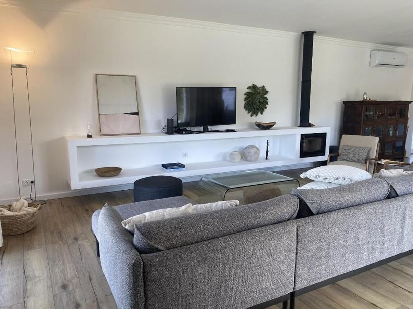 A living room with sofa and television