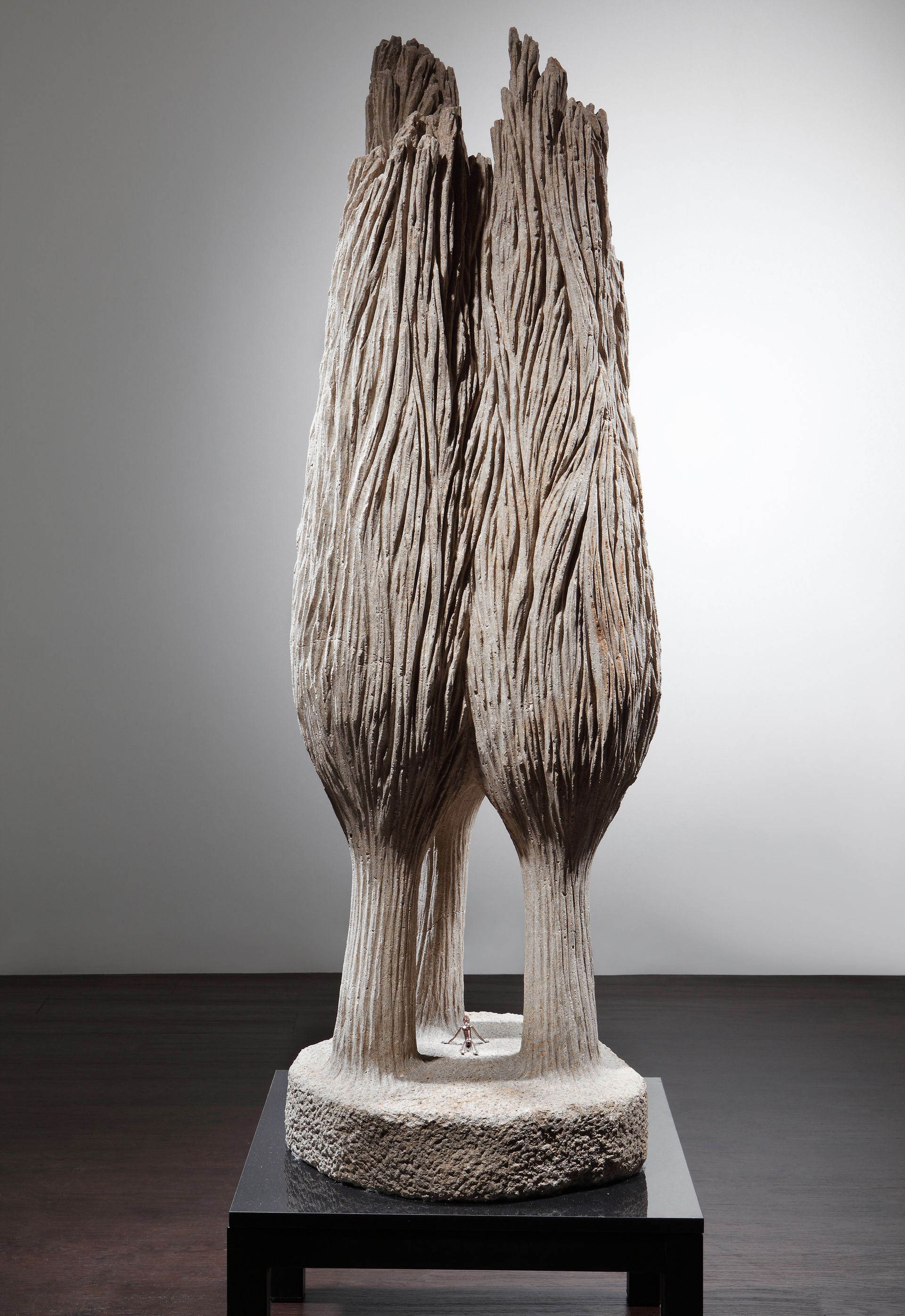 A statue of two trees is sitting on a table