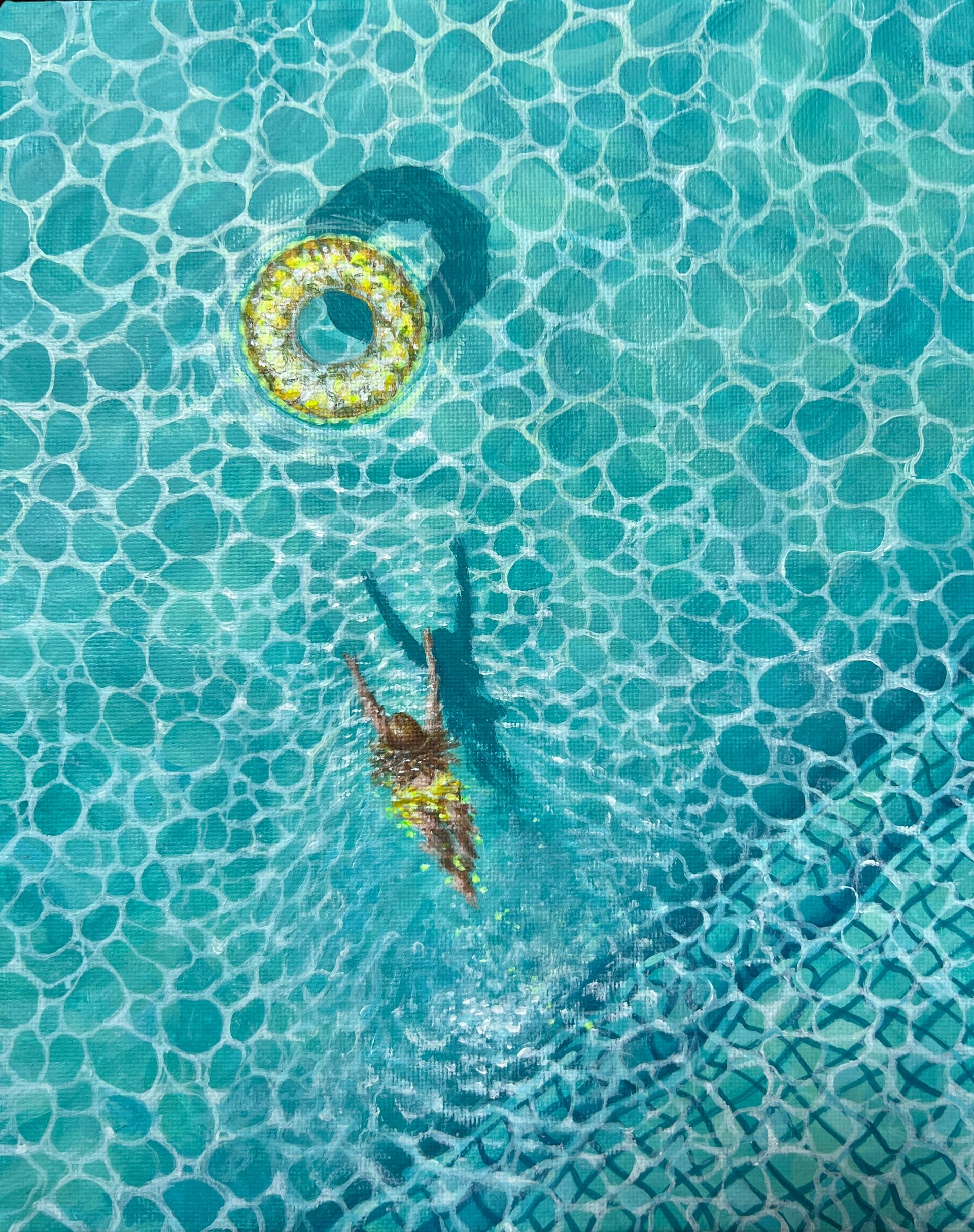 An aerial view of a person swimming in a swimming pool.