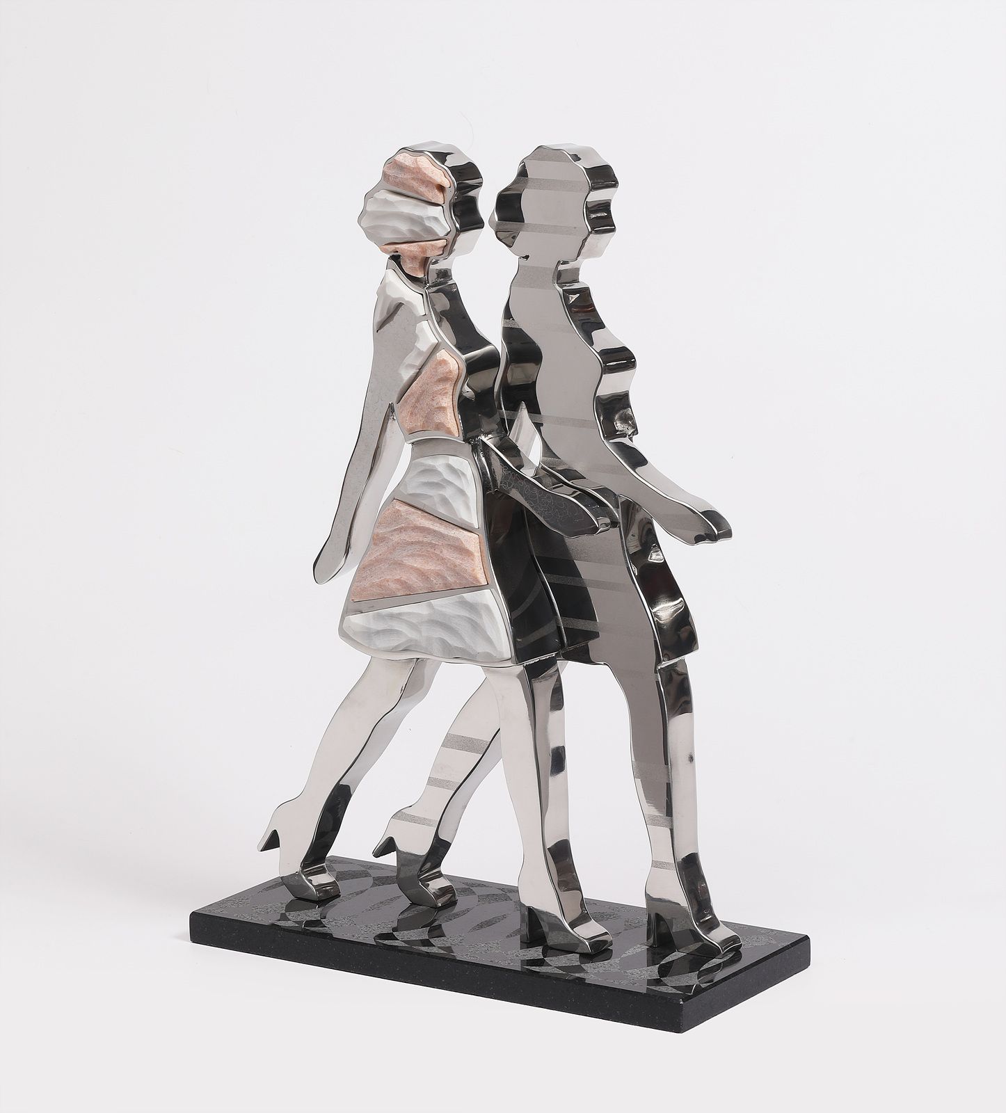 A statue of a man and a woman standing next to each other