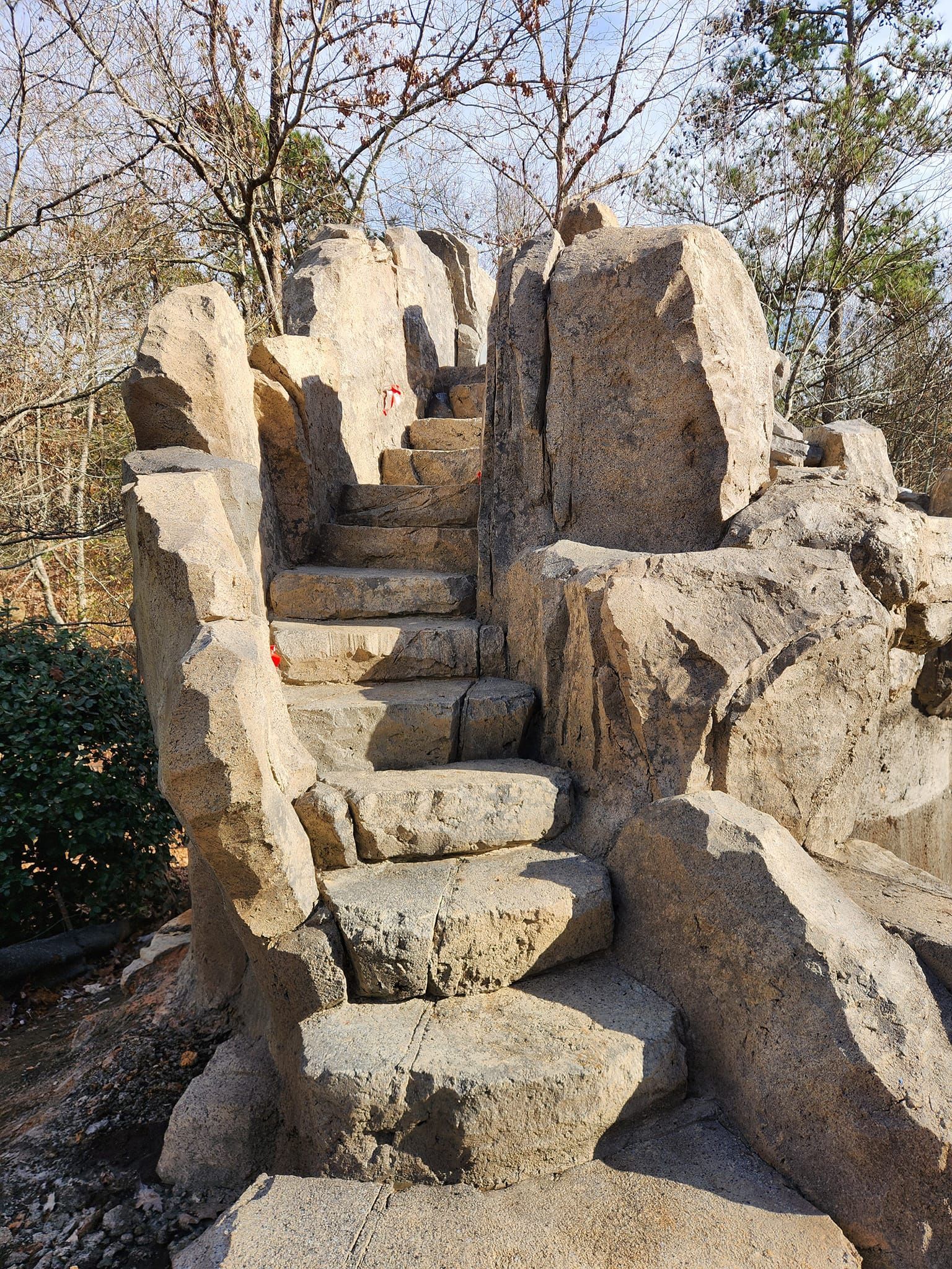 Stone steps carved into rock formations outdoors.