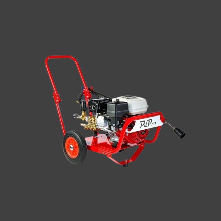 A red high pressure washer with wheels and a gas engine.