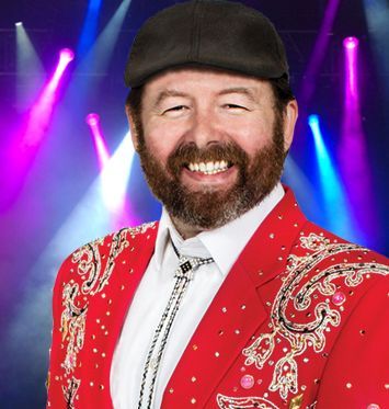 A man with a beard is wearing a red jacket and hat