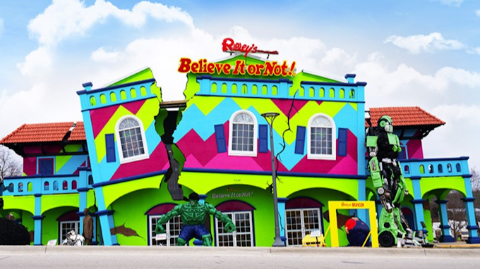 A colorful building with a sign that says believe bar not
