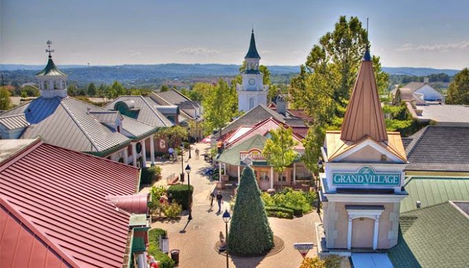 An aerial view of a small town with a christmas tree in the middle