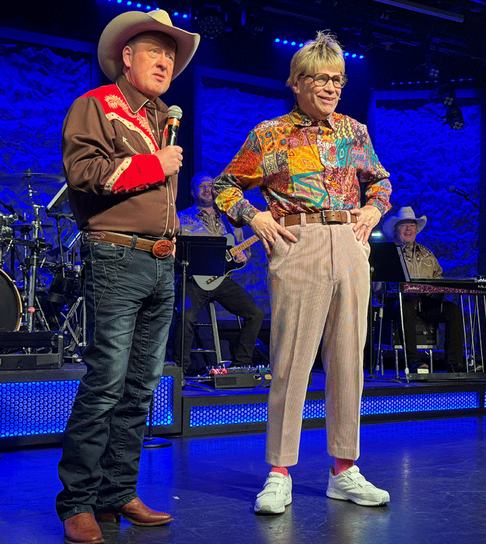 Four performers in western attire promote a country music show in Branson, Missouri, featuring the title Down Home Country.