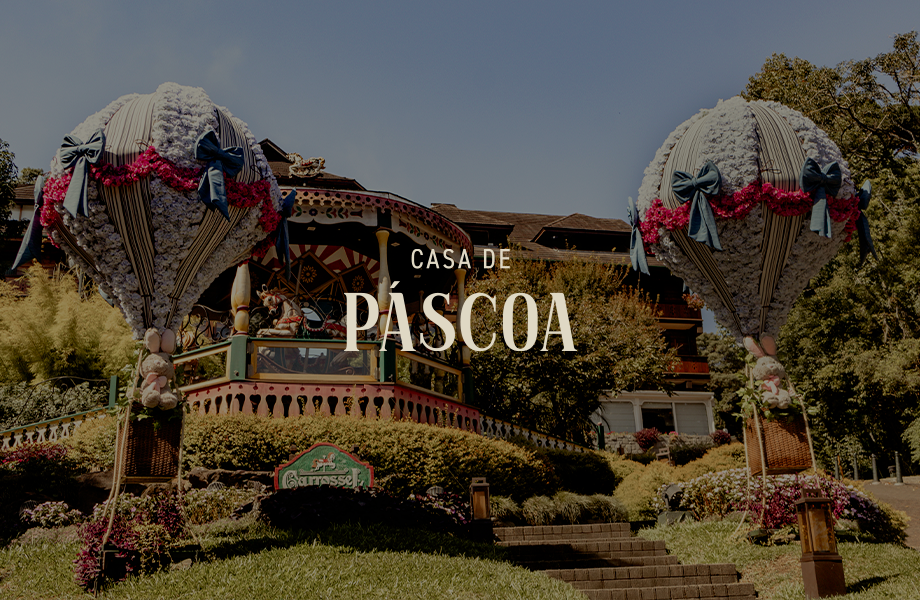 Casa de Páscoa, edifício festivo com decoração floral em forma de balão de ar quente num jardim.
