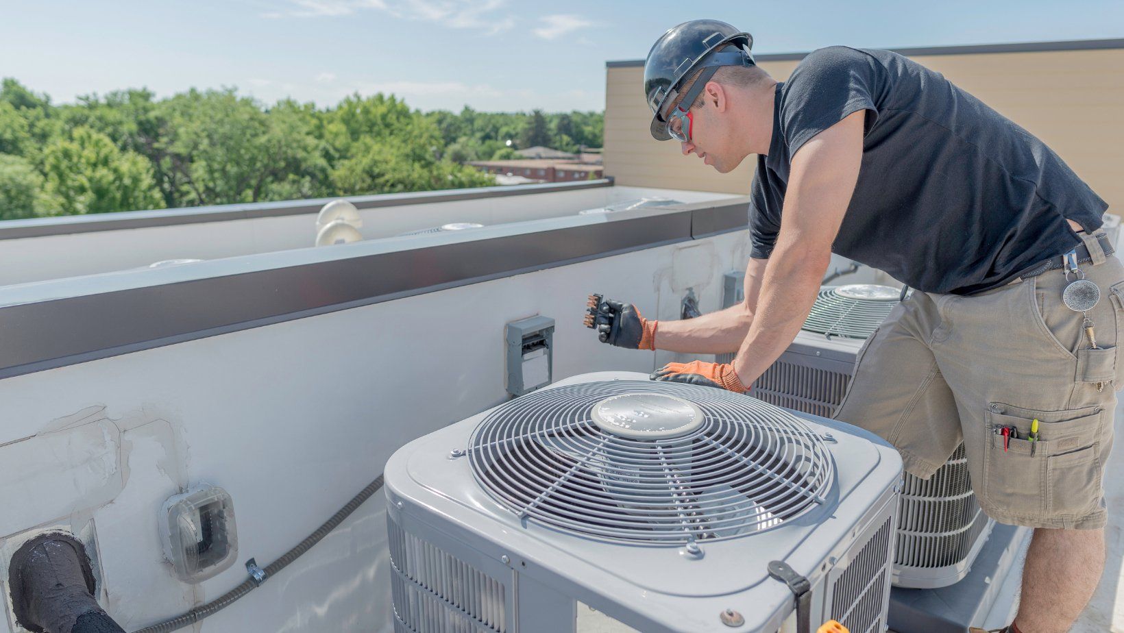man installing air conditioner