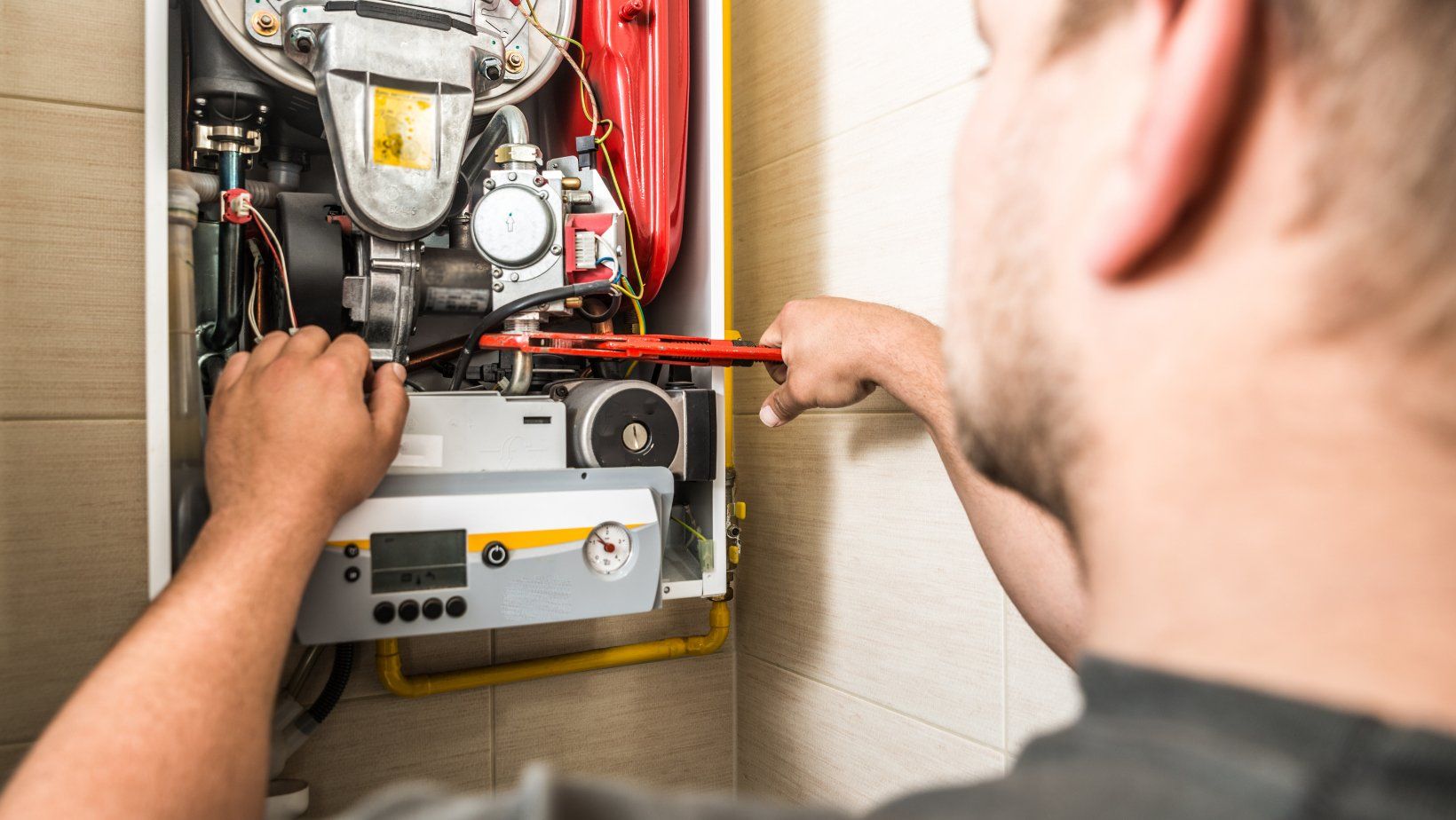 a man repairing furnace
