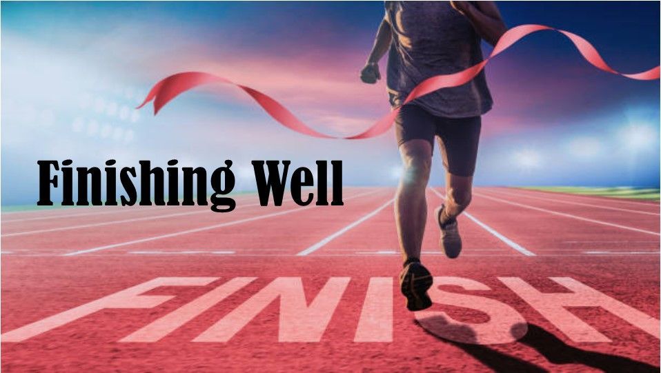 A person running on a track with the words finishing well written on it