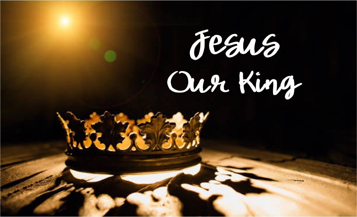 A crown is sitting on a wooden table with the words `` jesus our king '' written on it.