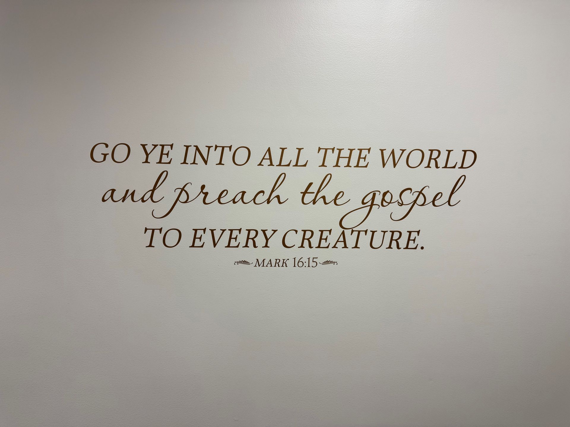 Wall quote reading, “Go ye into all the world and preach the gospel to every creature.”