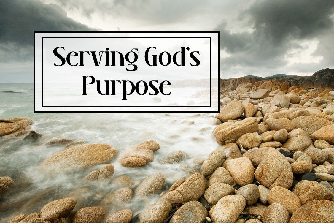 A picture of a rocky beach with the words `` serving god 's purpose '' above it.