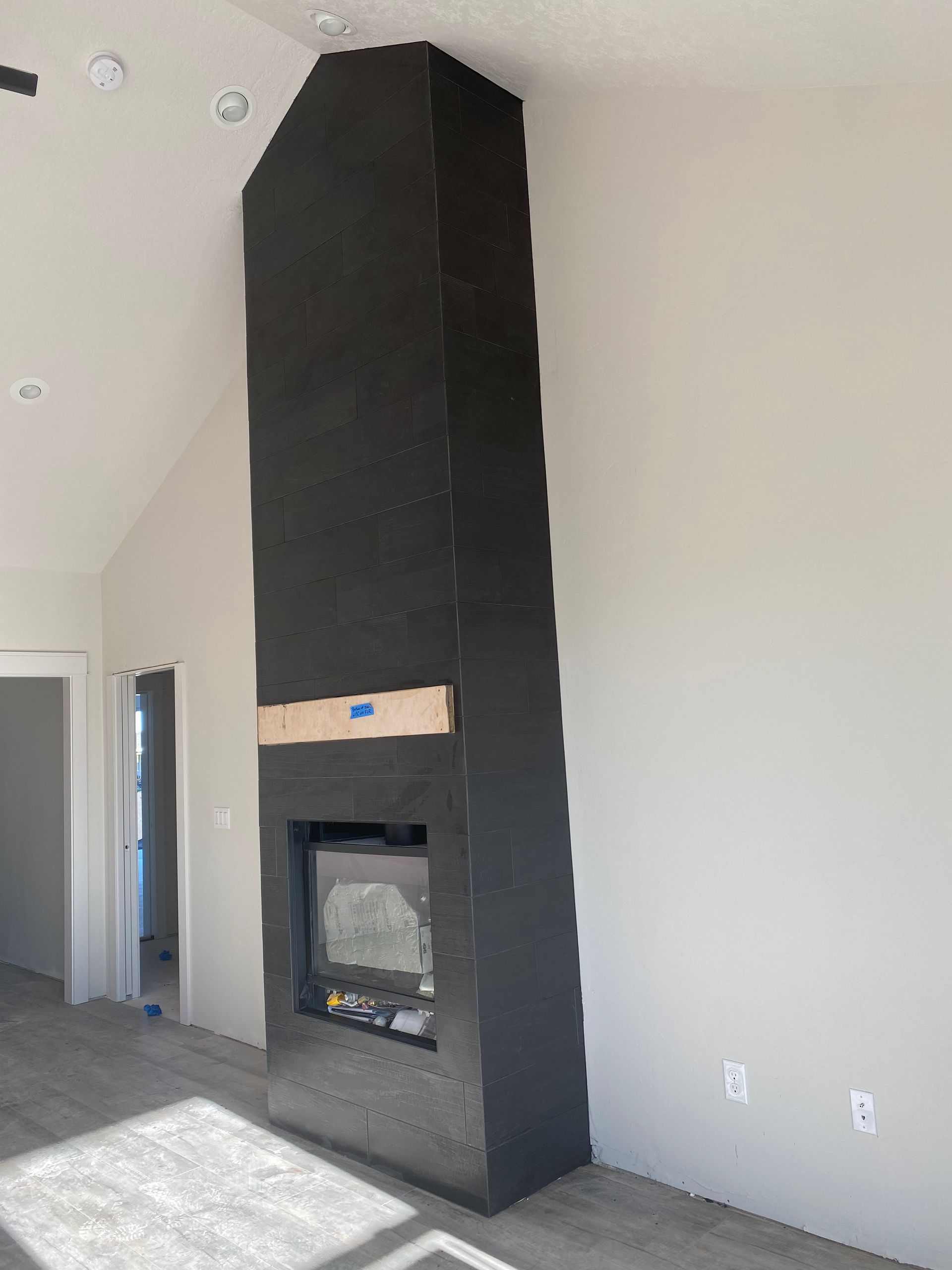 There is a fireplace in the middle of the room.