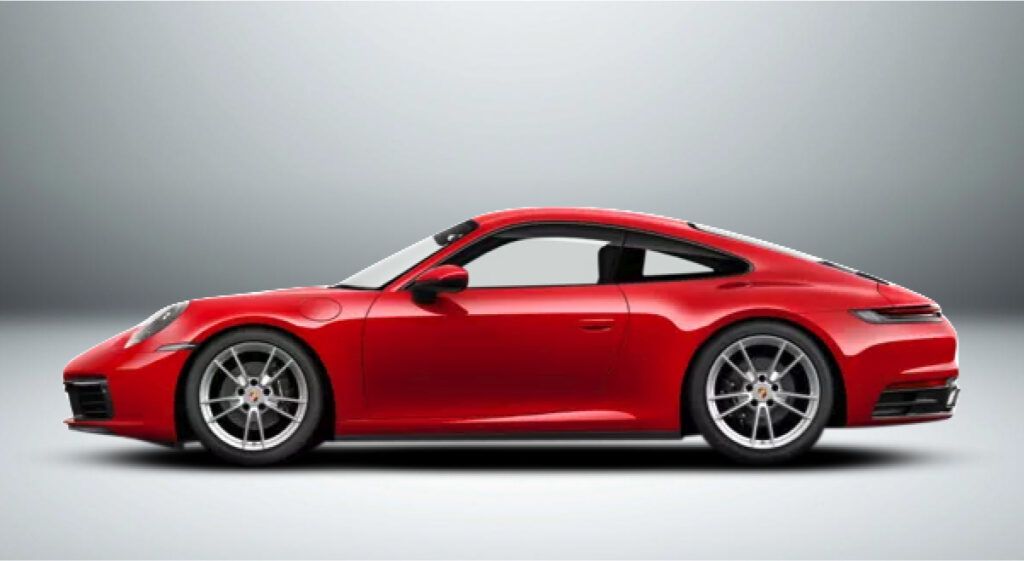 Um porsche 911 vermelho está sobre uma superfície branca.