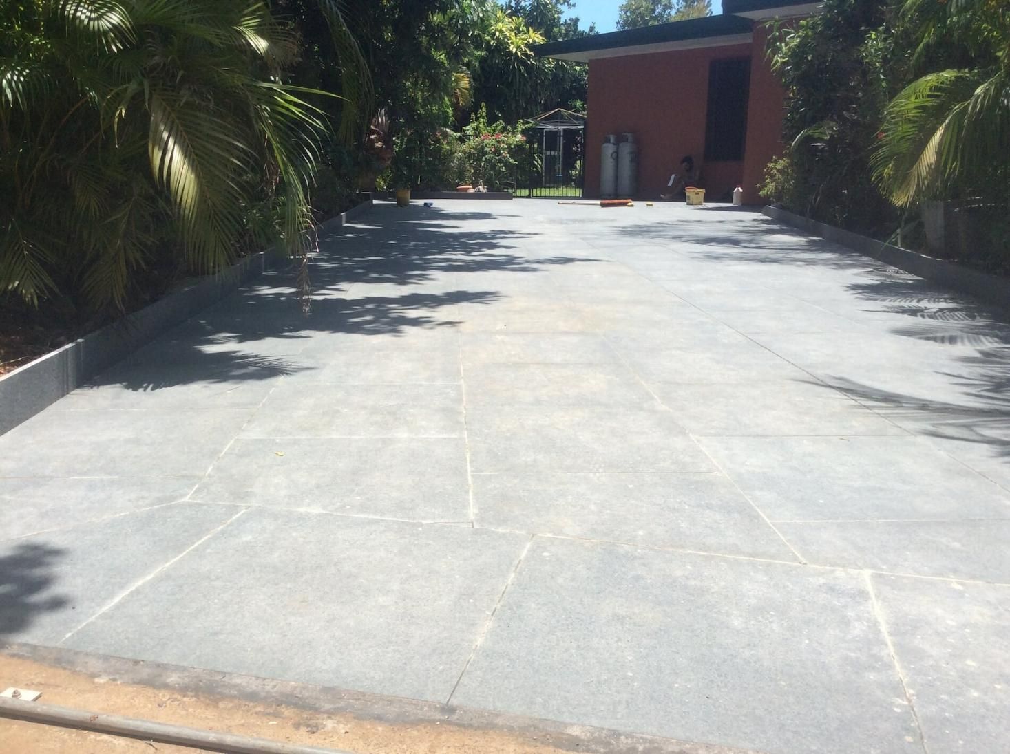 Driveway Paving with Small and Big Trees on Either Side — Paving in Darwin River, NT