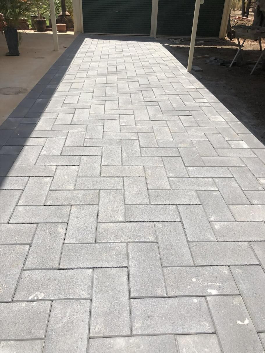 An Empty Pathway with Sunlight Falling on the Tiles — Paving in Darwin River, NT